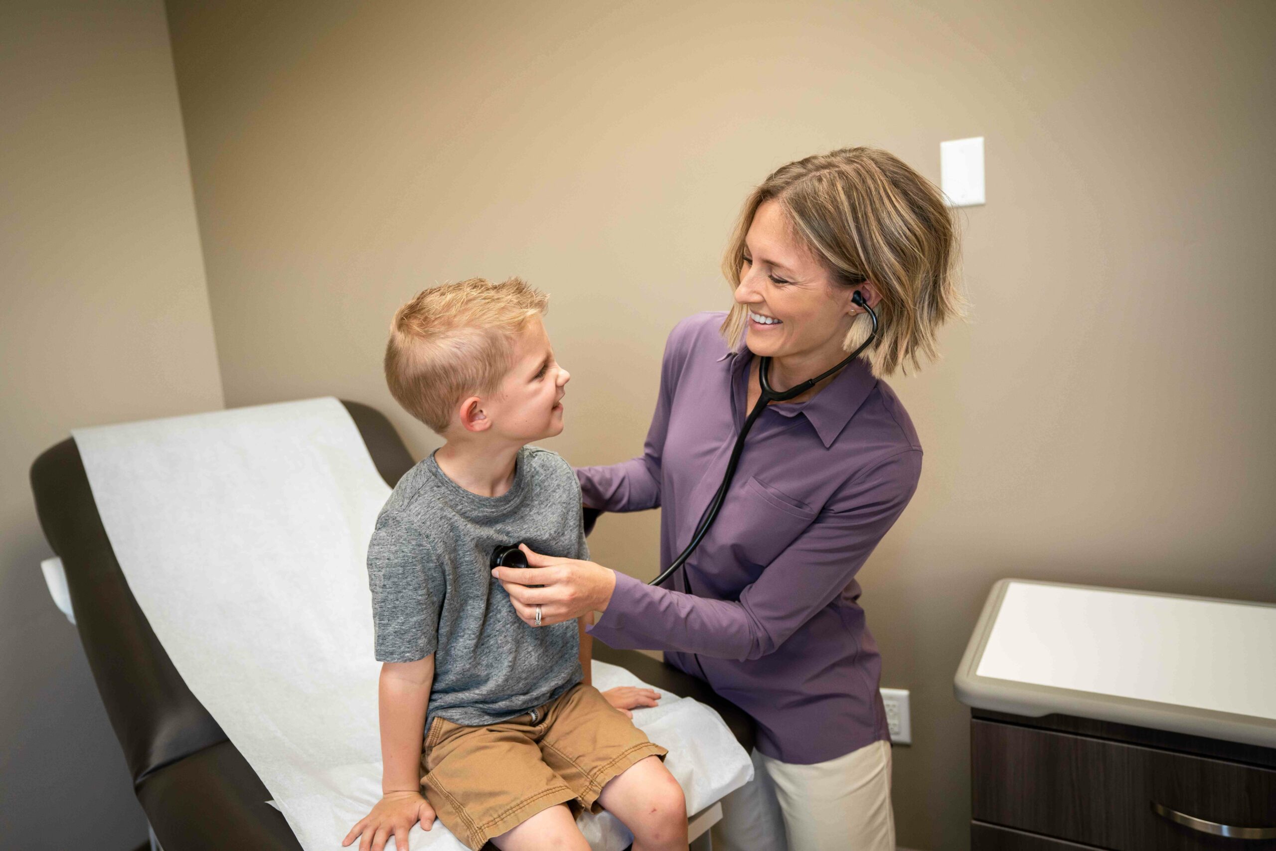 A Pediatrician from Canyon View Medical working with her patient